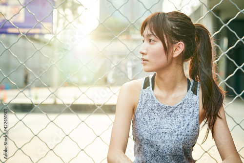outdoor portrait of an asian athletic girl