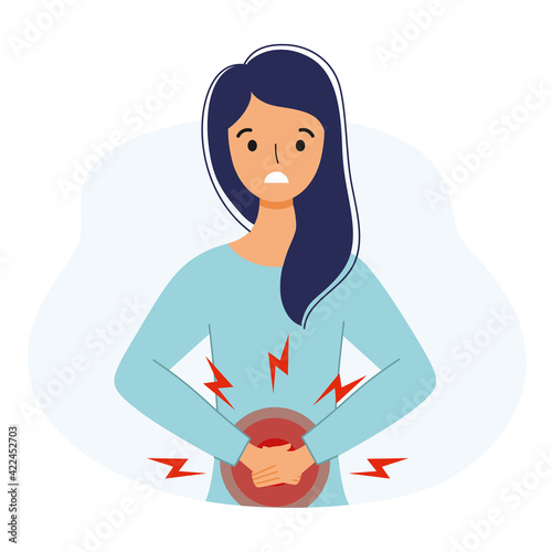 The girl suffers from abdominal pain. Symptoms of gastritis in a woman.