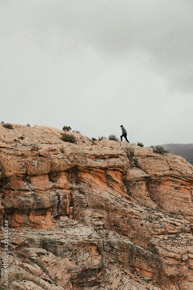person climbing rocks