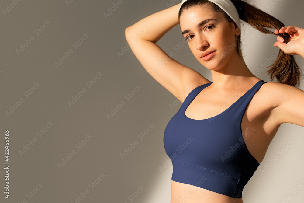 Beautiful woman in yoga outfit with headband sportswear fashion shoot Beautiful woman in yoga outfit with headband sportswear fashion shoot
