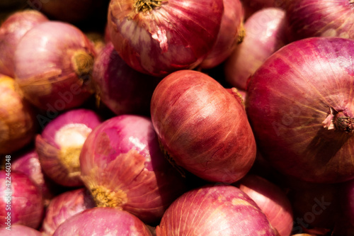 top shot of red onions stock isolated on basket