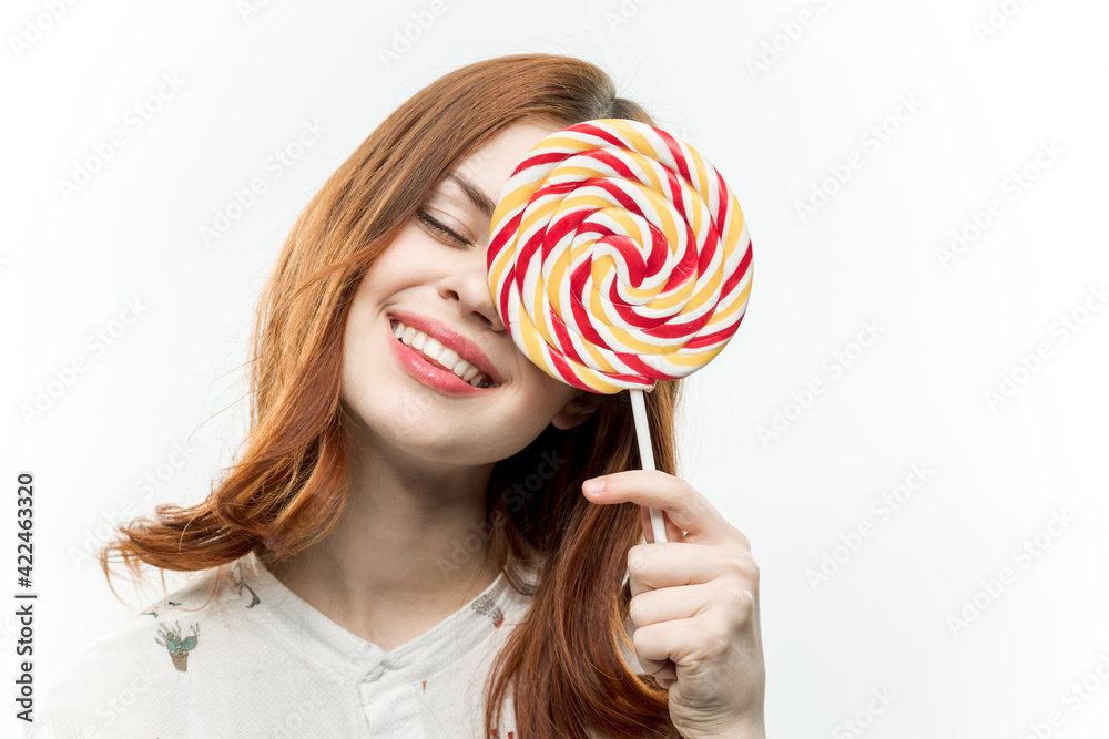 cheerful woman with a circle of colorful lollipop sweets lifestyle dessert