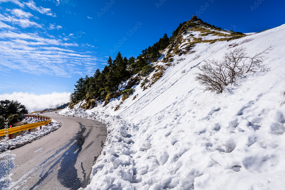snow and ice covered on asphalt road in Hehuan Mountain of Taiwan, Asia. Taroko National Park is one of Taiwan's most popular tourist attractions. snow and ice covered on asphalt road in Hehuan Mountain of Taiwan, Asia. Taroko National Park is one of Taiwan's most popular tourist attractions.