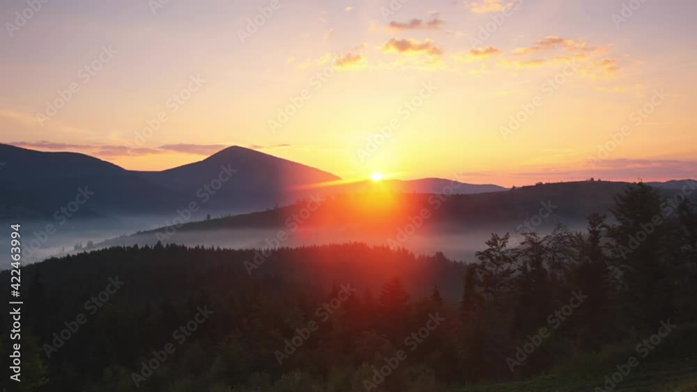 Sun Rises Behind the Peaks of the Mountains. Fast Motion Sun Rises Behind the Peaks of the Mountains. Fast Motion
