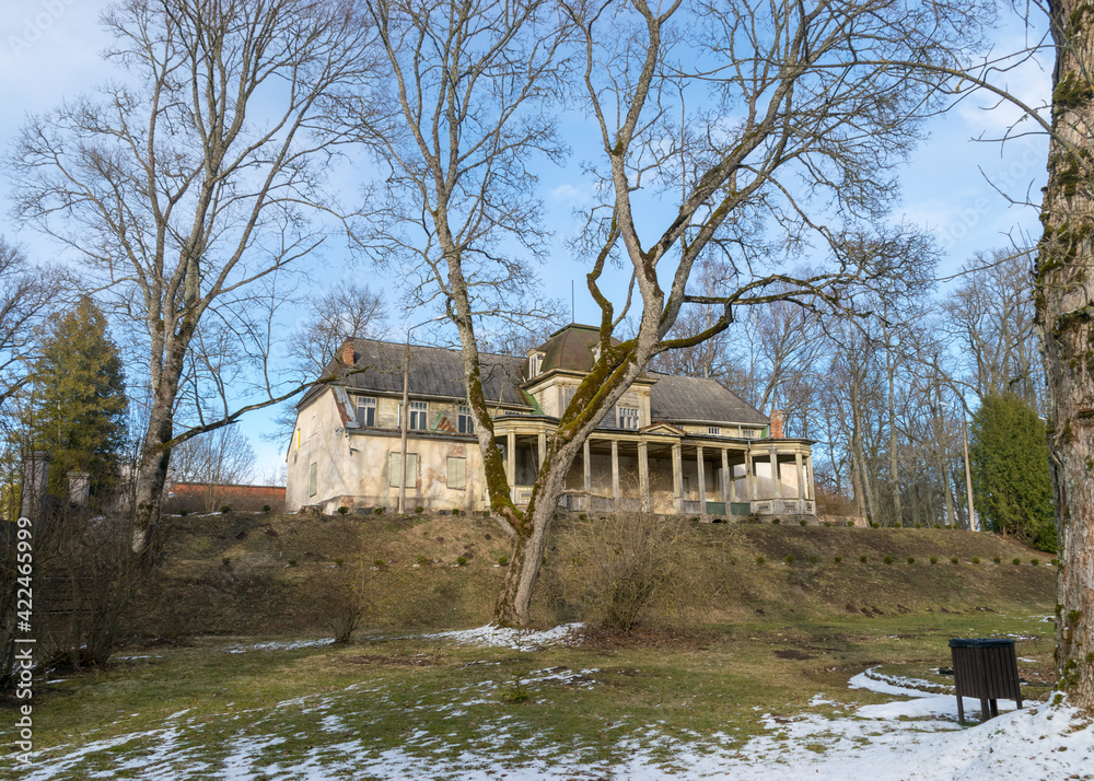 landscape with Burtnieki manor building, early spring in the manor park, bare tree silhouettes, Burtnieki manor landscape with Burtnieki manor building, early spring in the manor park, bare tree silhouettes, Burtnieki manor