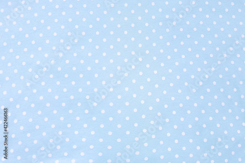 Polka dot blue fabric background and texture. Wallpaper, card, cover design and decor