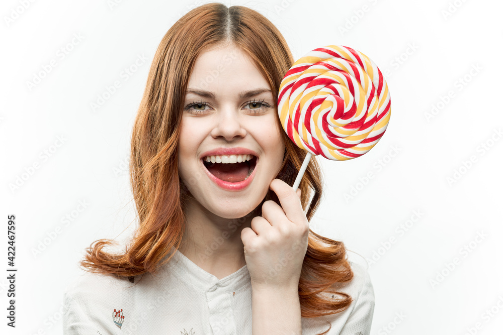 woman with multicolored round lollipop in hands sweets 