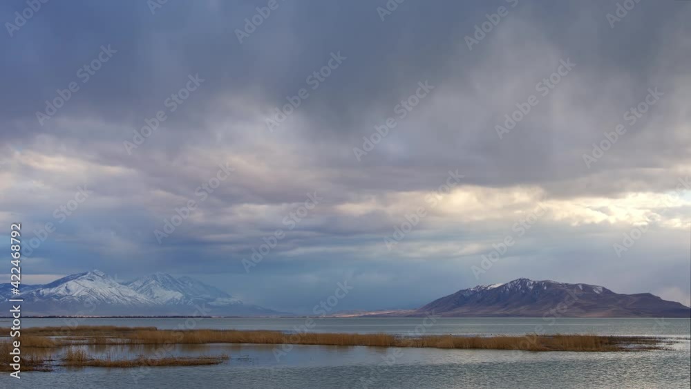 Rain storm rolling over Utah Lake in time lapse looking towards Mt. Nebo and West Mountain. Rain storm rolling over Utah Lake in time lapse looking towards Mt. Nebo and West Mountain.