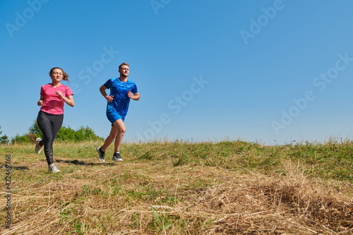 couple jogging in a healthy lifestyle on a fresh mountain air