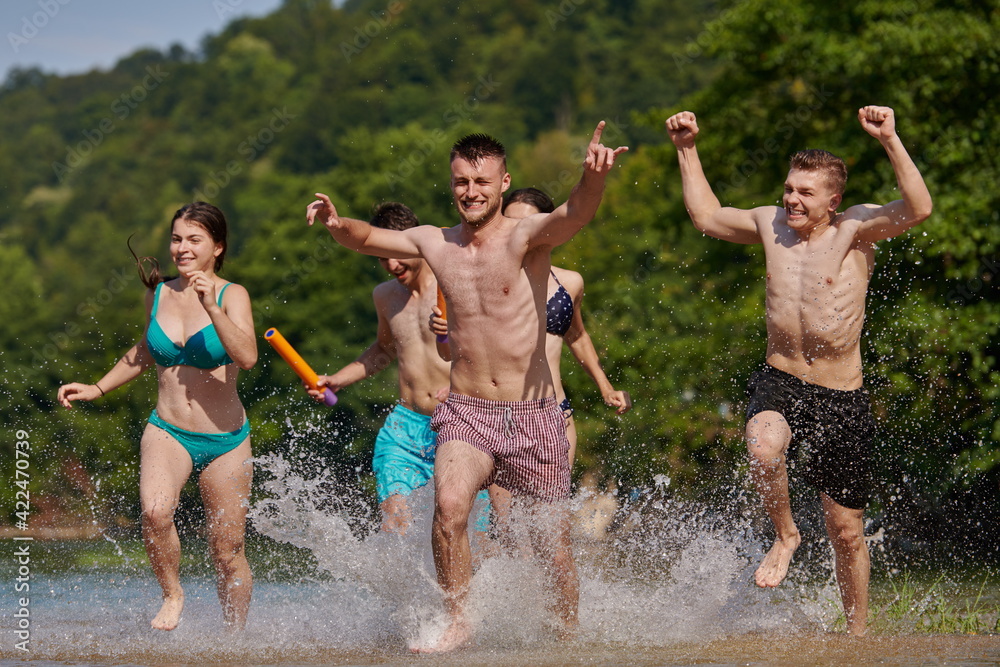 group of happy friends having fun on river group of happy friends having fun on river