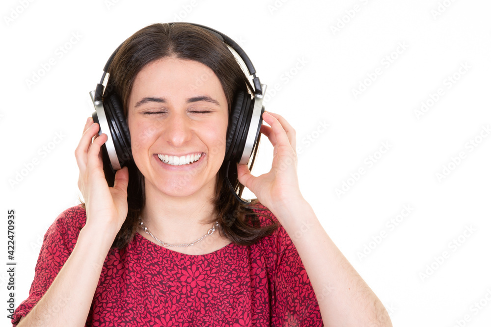 young woman enjoys musicians music in headphones on white background young woman enjoys musicians music in headphones on white background