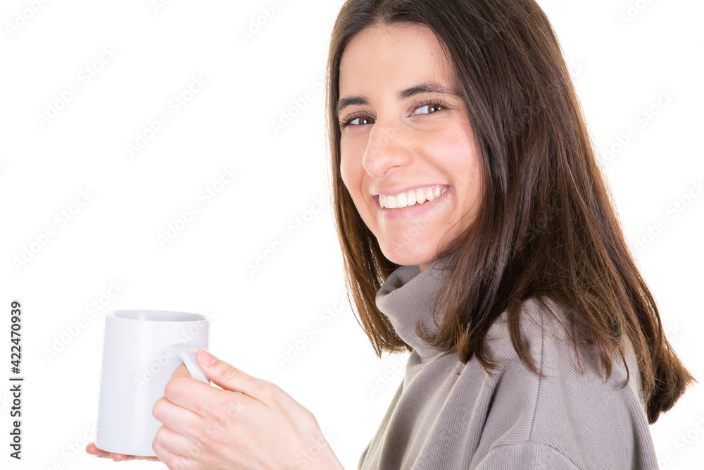 Young woman on isolated white background holding blank hot drink tea mug cup of coffee Young woman on isolated white background holding blank hot drink tea mug cup of coffee