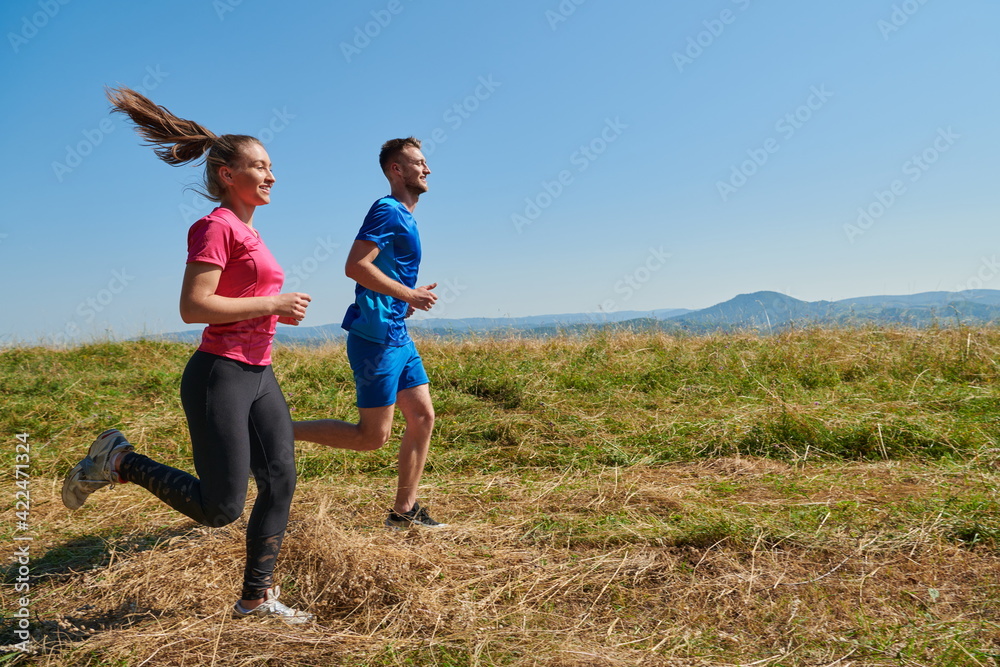 couple jogging in a healthy lifestyle on a fresh mountain air couple jogging in a healthy lifestyle on a fresh mountain air