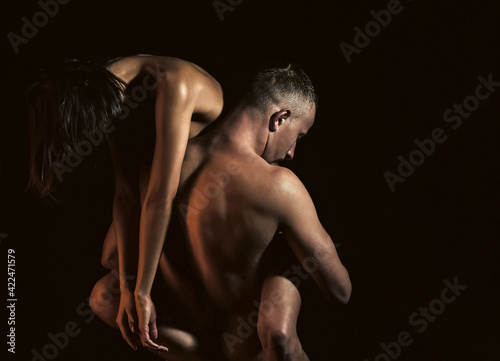 Sensual Couple in love. Intimate passionate sensual people enjoying tenderness. Man hold woman with sexy naked body