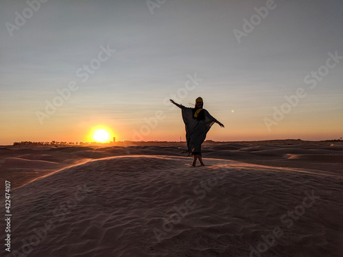 Young girl posing in the desert of Tunisia