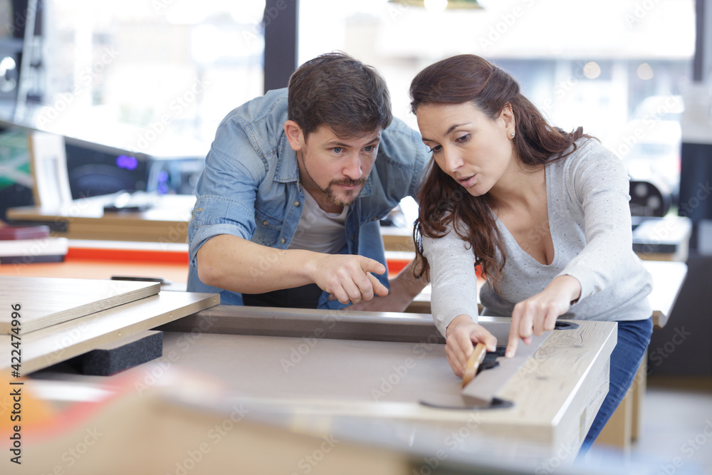 Fototapeta premium woman is brushing the snooker table