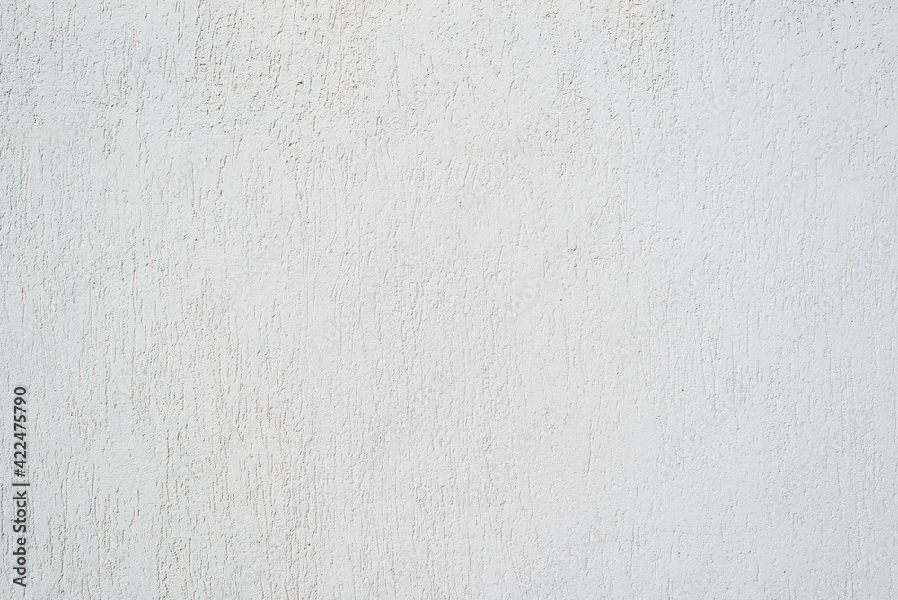 Obraz premium White wall finished with decorative plaster for outdoor use. Textured background with scratches