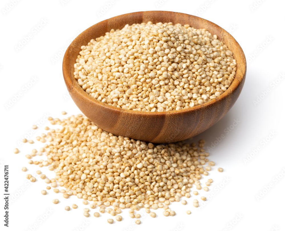 uncooked white quinoa, in the wooden bowl, isolated on pure white background uncooked white quinoa, in the wooden bowl, isolated on pure white background