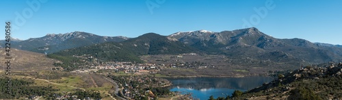 Panoramic view of the lake and the village of Navacerrada in the Community of Madrid with the Sierra de Guadarrama in the background - Siete Picos - Bola del Mundo - La Maliciosa