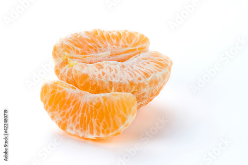 Close-up peeled oranges isolated on a white background