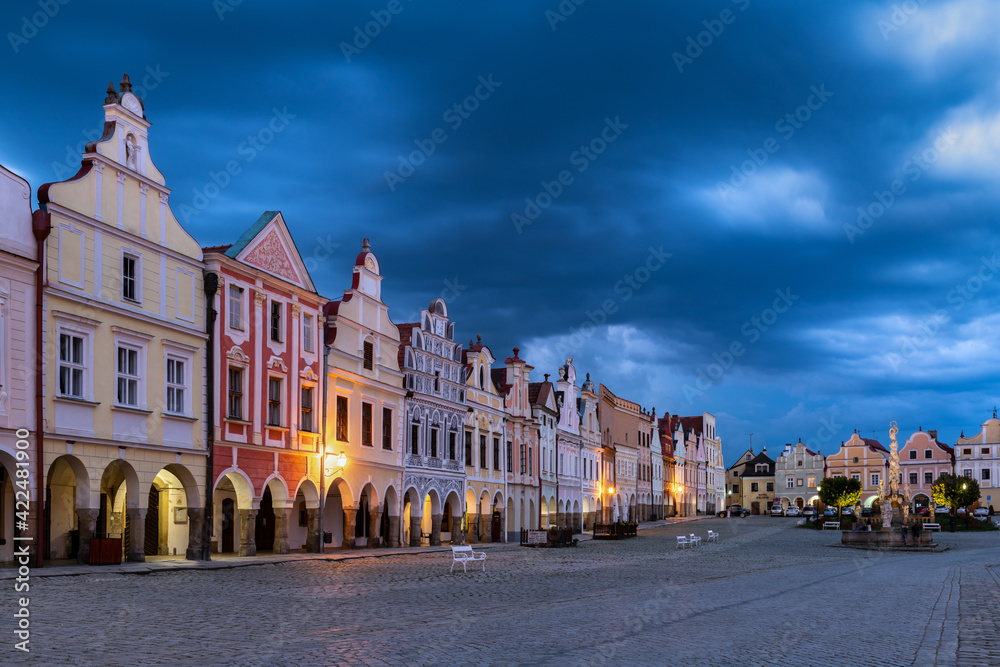 Row of traditional houses in the town of Telč, Czech Republic, at twilight. These houses on the main square are UNESCO heritage site.