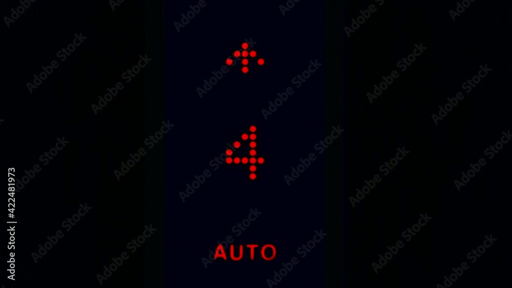 Elevator numbers on a black background. Changing numbers and a moving elevator panel to different floors in a high-rise building.
