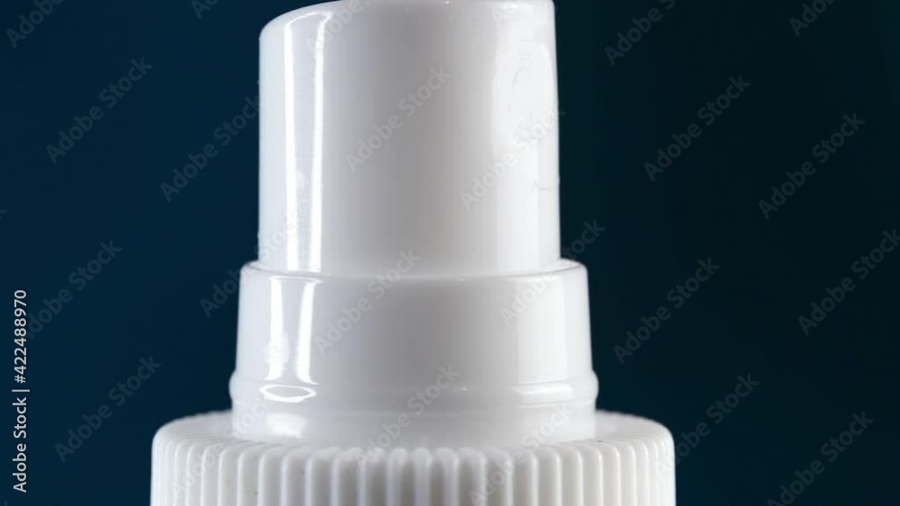Finger pressing on button on the bottle with liquid soap
Finger pressing on button on the bottle with liquid soap