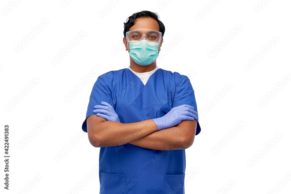 indian male doctor in blue uniform and mask indian male doctor in blue uniform and mask
