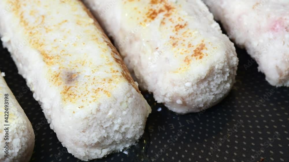 Flowing oil on a pan with frying chicken meat cutlets macro video 4k Flowing oil on a pan with frying chicken meat cutlets macro video 4k