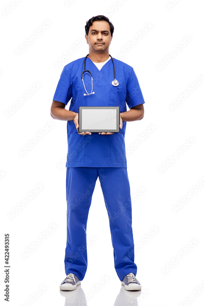 indian doctor or male nurse showing tablet pc indian doctor or male nurse showing tablet pc