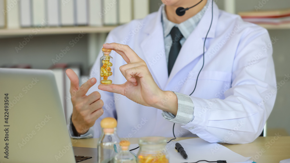 Ethnic man consulting patient with drugs online Ethnic man consulting patient with drugs online