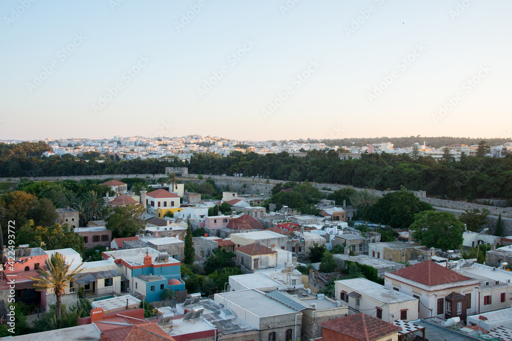 Aerial panoramic view of Rhodes town before sunset. Buildings, ancient walls. Dodecanese. Greece.