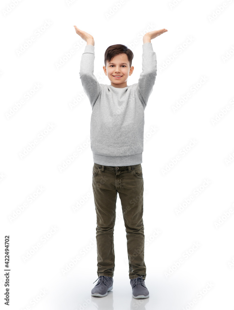happy smiling boy holding something imaginary happy smiling boy holding something imaginary