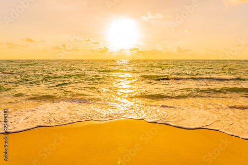 Beautiful tropical beach sea ocean at sunset or sunrise time