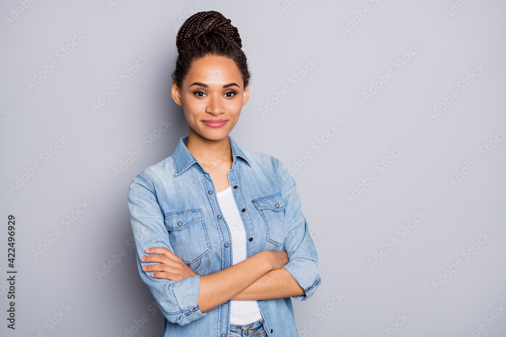 Photo portrait of african american woman with crossed hands isolated on clear grey colored background with blank space Photo portrait of african american woman with crossed hands isolated on clear grey colored background with blank space