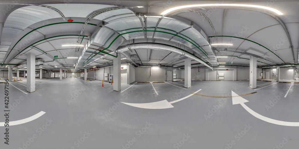Full  spherical hdri panorama 360 degrees in empty underground garage parking with columns and road markings in equirectangular projection,  VR content
