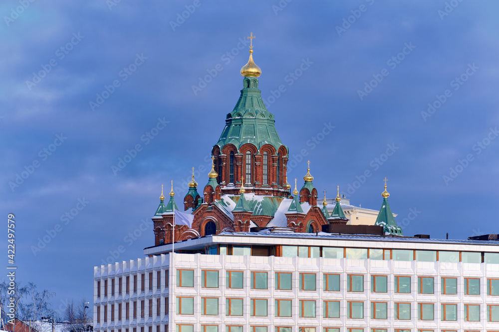Uspenski Cathedral, St Nicholas Church, Helsinki, Finland. On the foreground the white modern office building.
