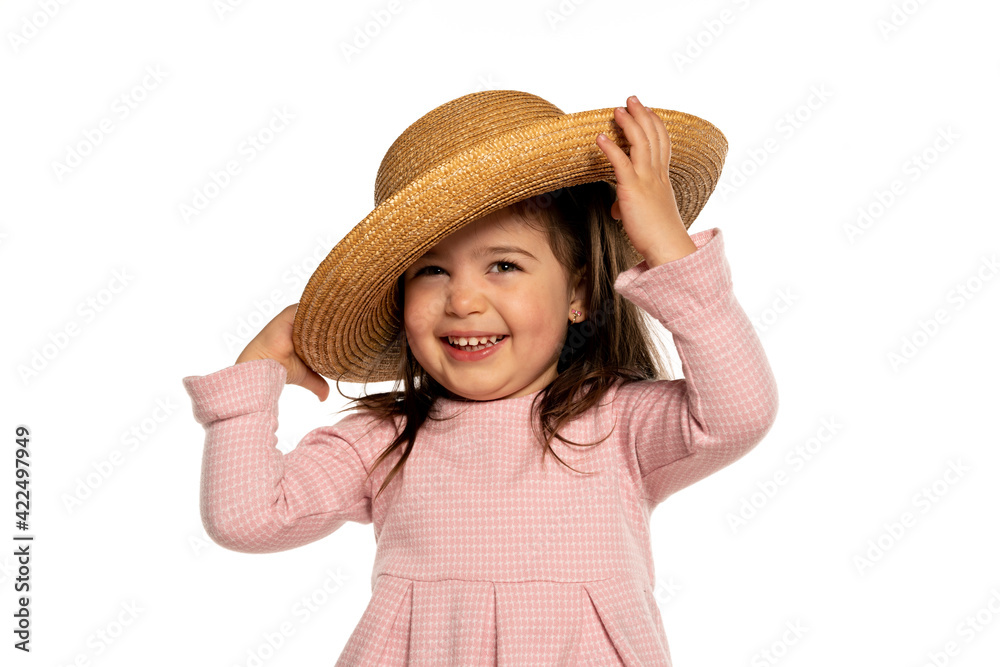 Little happy girl posing with a hat Little happy girl posing with a hat