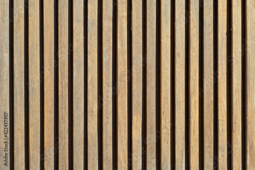 Wall texture with striped paneling. Wood paneling close up.