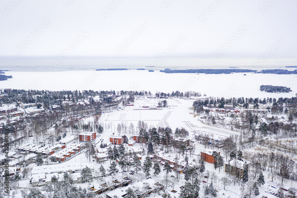 Aerial view of Matinkyla neighborhood of Espoo, Finland. Snow-covered city in winter.