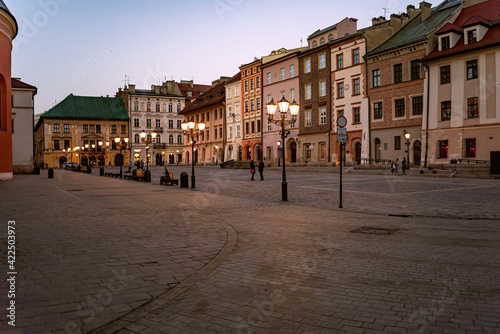 Cracow Little Market Square in the evening, with lanterns already turned on. . photo