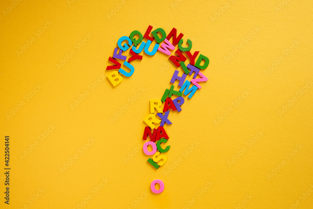 Alphabet forming a question mark on a yellow background Concept of education and knowledge Alphabet forming a question mark on a yellow background Concept of education and knowledge