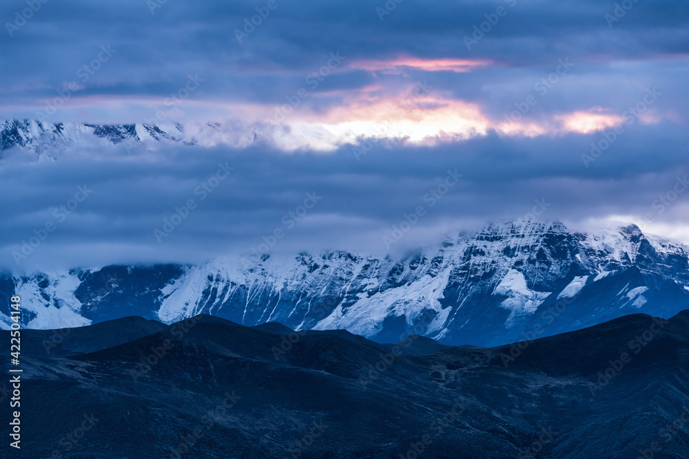 Snow-capped mountains and morning fire clouds