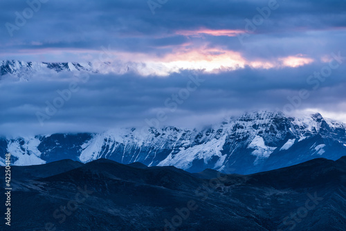 Snow-capped mountains and morning fire clouds