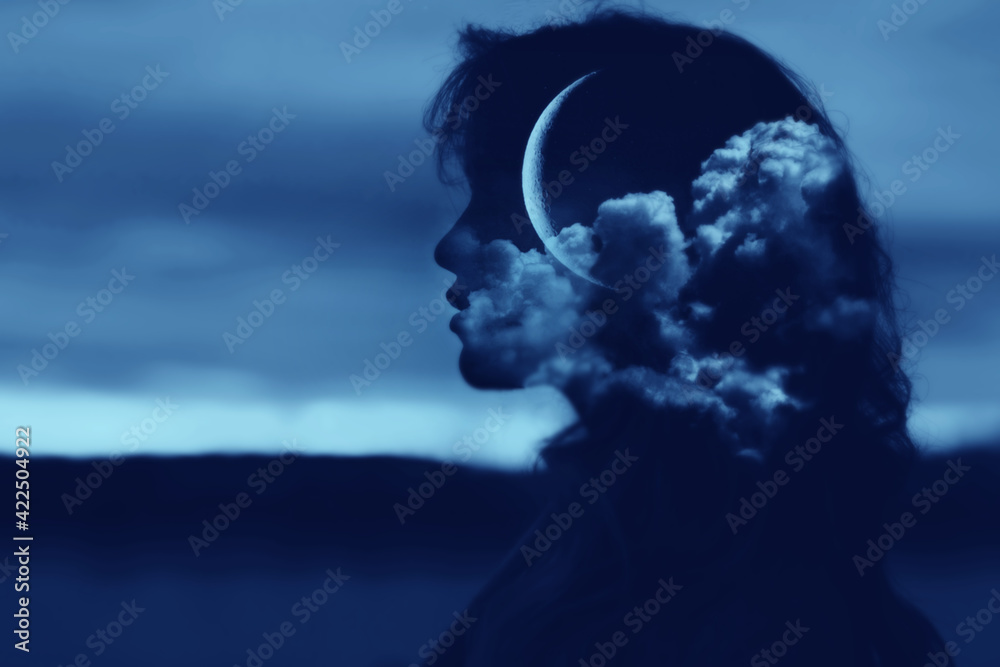 Woman profile silhouette portrait with moon and clouds in her head. Psychology and menstrual cycles concept.