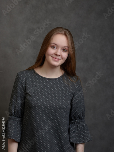 Young long-hared woman looking at camera