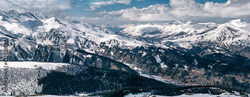 Panoramic view of snowcapped Arkhyz mountains in Karachay-Cherkessia (Russia)