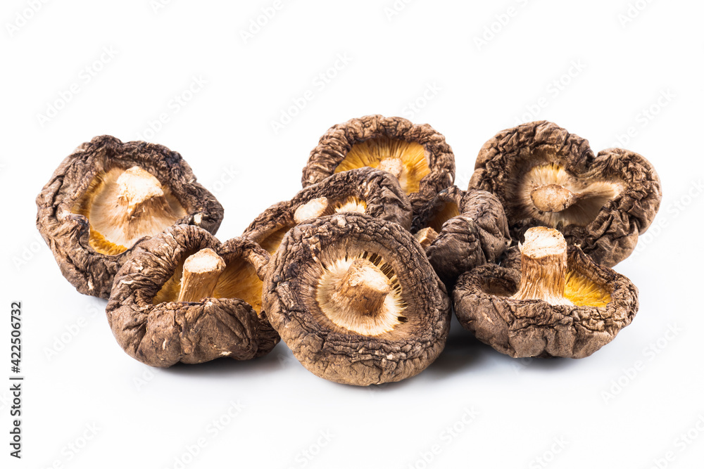 Close-up of dried shiitake mushrooms isolated on white background. Close-up of dried shiitake mushrooms isolated on white background.