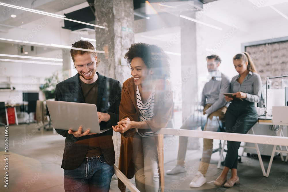 Programmers cooperating brainstorming at information technology company ...