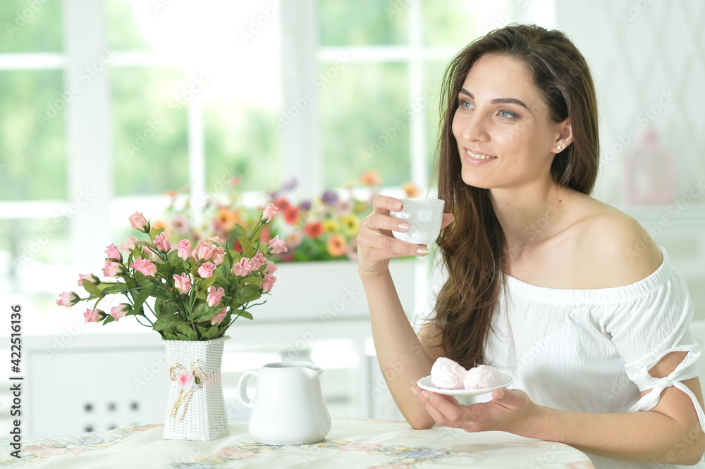 young beautiful woman holding white cup at home young beautiful woman holding white cup at home
